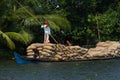 Allepey, Kerala, India Ã¢â¬â March 31, 2015: Indian man transport dwell with rice for boats. backwaters canoe in state Royalty Free Stock Photo